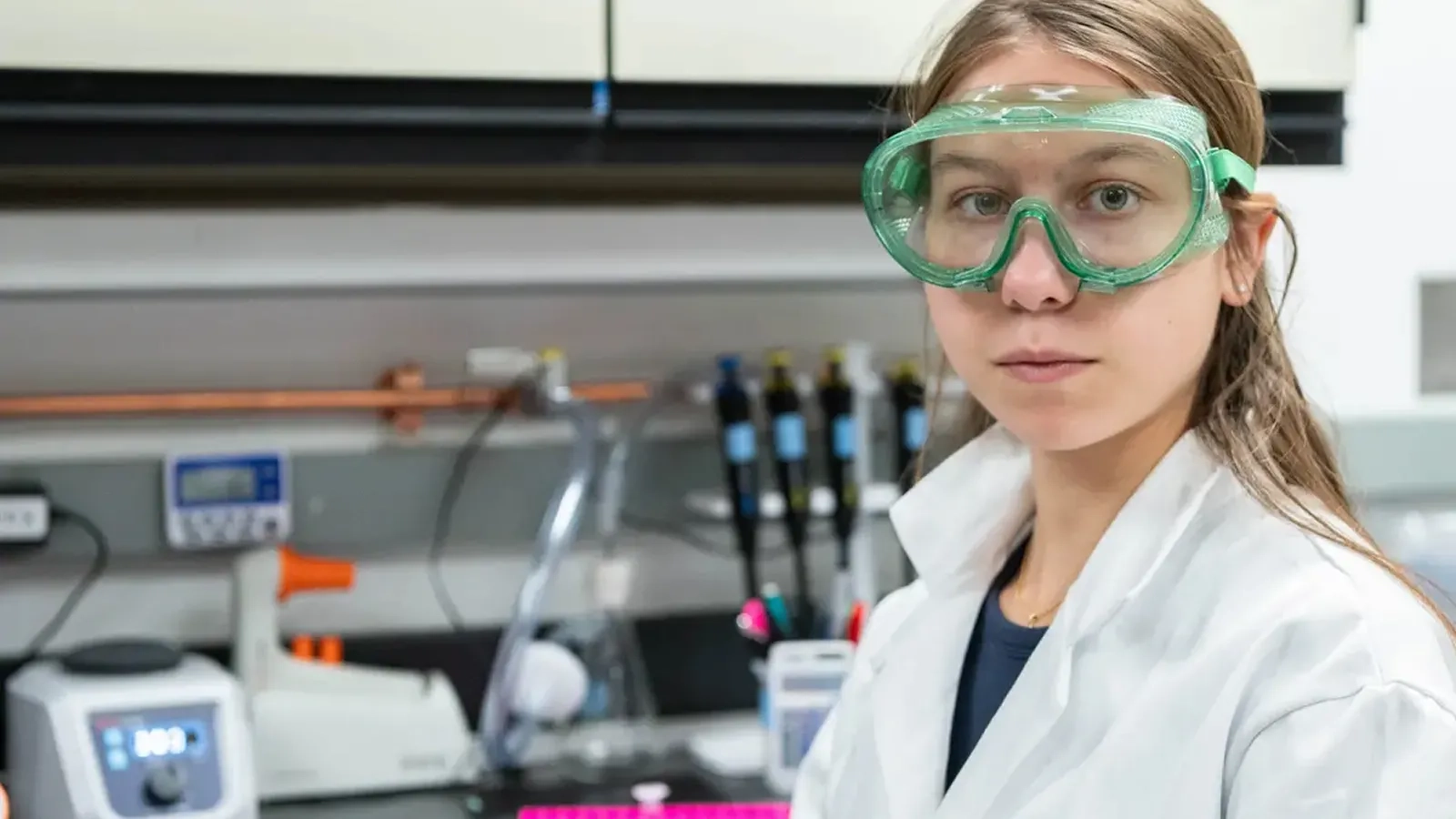 Noémie Gomes-Jourdan, a CMU student, stands in a lab. 