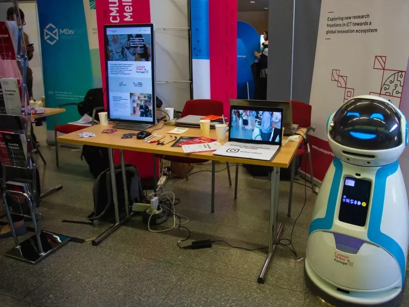 CMU Portugal stand showing a robot.