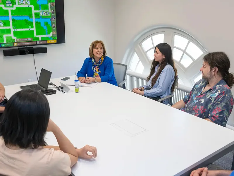 Coty Gonzalez (center) and members of the Dynamic Decision Making Laboratory