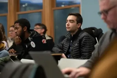 Students sitting at desks in a classroom